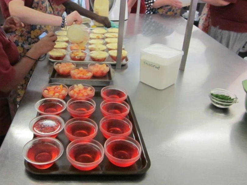 Photograph of trays of Jell-O on a cafeteria table