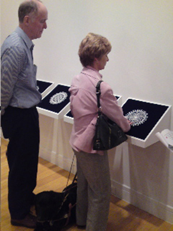Laura Splan, installation view of doilies, from left to right: HIV, Hepadna, SARS, Herpes, Influenza, 2004, freestanding computerized machine-embroidered lace mounted on velvet, 16.75 x 16.75 in. (42.5 x 42.5 cm) each (framed dimensions). Collection of the artist