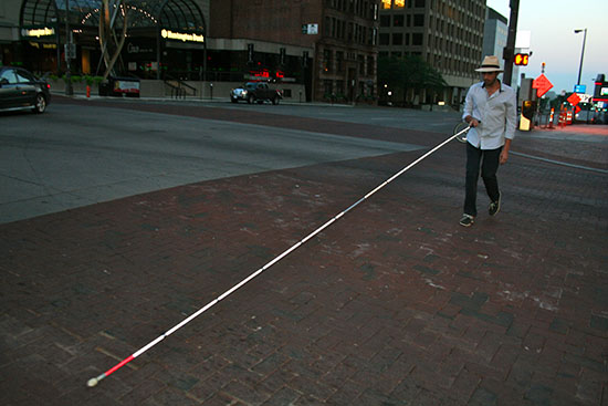 Photo of author using a twelve-foot mobility cane.