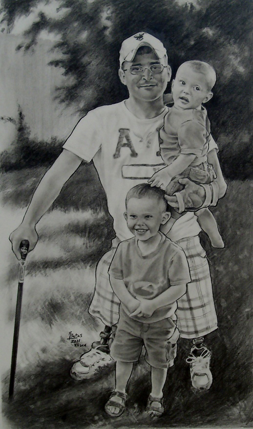Bowman stands in a fenced-in and grassy backyard; he smiles at us, holding one of his children with the arm from which fingers are missing, standing on his shorties (beginner prostheses).
