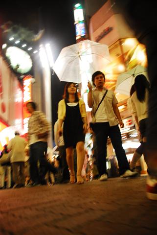 photograph titled Woman and Man; Kuala Lampur, Malaysia (2007)
