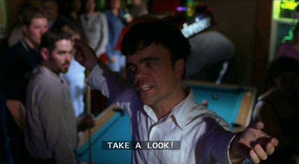 A drunk Fin invites attention in a crowded bar