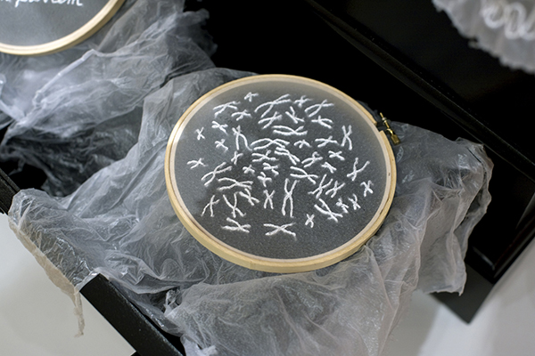 Laura Splan, Trousseau Series, detail of embroidery hoop, Subcutaneous, 2009, hand embroidery with thread on cosmetic facial peel, wood embroidery hoop, diameters range from 6 inches - 7 inches. Collection of the artist
