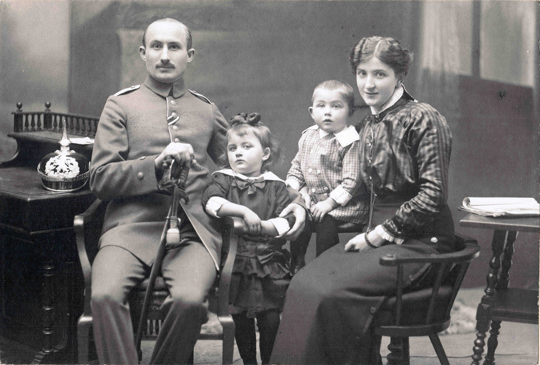 A black and white photograph of Christian Rau, Marie Rau, Walter Rau, and Emilie Rau, left to right.