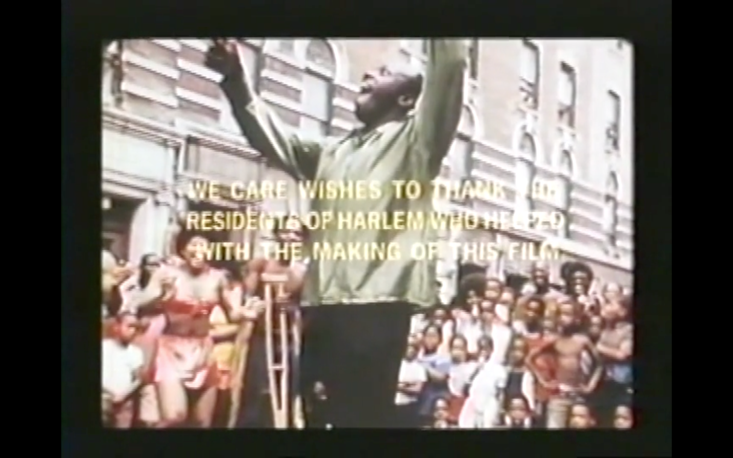 The image shows the man with one leg dancing without any crutches as the crowd continues to look on, many with smiles on their faces. One of the dancers behind him is holding his crutches. Another dancer is clapping joyously. Over this scene appears these words: We Care wishes to thank the residents of Harlem who help with the making of this film. The image is used with permission of Oren Jacoby.